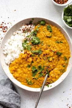 a white bowl filled with rice and curry