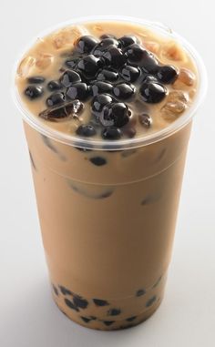 an iced drink with black olives in it