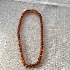 100% Authentic 20 Inch Amber Beaded Necklace.. This Still Has The Tags On It. I Have Never Worn It. It’s In Pristine Condition. Each Bead Is 7 Mm. Tory Burch Necklace, Red Crystal Necklace, Coin Pearl Necklace, Amber Bead Necklace, Feminine Necklace, Tanzanite Pendant, Bride Necklace, Beaded Tassel Necklace, Layered Necklaces Silver