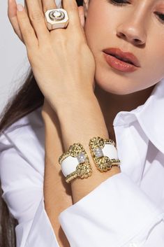 David Webb white enamel rope cuff bracelet in yellow gold. 18K Yellow Gold, Platinum, Enamel Brilliant-cut diamonds 2.60ctw Luxury Enamel Cuff Bracelet, Elegant Enamel Cuff Bracelet For Formal Occasions, Designer Enamel Bangle Jewelry, Luxury Enamel Cuff Bracelet Bangle, Luxury Enamel Cuff Bangle Bracelet, Luxury Enamel Cuff Bangle, Luxury White Diamond Jubilee Bracelet, Elegant White Gold Enamel Bracelets, White Luxury Jubilee Diamond Bracelet