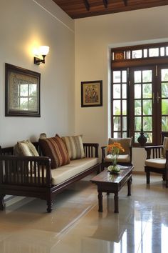 a living room filled with furniture and windows