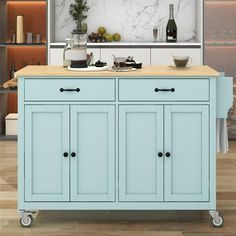 a kitchen island with two drawers on wheels