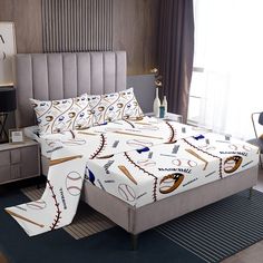 a baseball themed comforter set on a bed