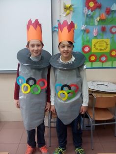 two children wearing costumes made to look like olympic rings and olympics rings on their heads