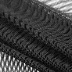 black mesh fabric with white dots on it