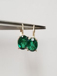 "Thanks for shopping our vintage estate store. We tend to sell well below wholesale and truly hope you enjoy all of our items. Many of the items are one of a kind, so please enjoy scrolling through the pictures and hopefully something will catch your eye. Brown spots are from reflections or camera. Nice estate 14k yellow gold created 3ct emerald lever back earrings. Gems are testing natural, but the are created. Retail $399 on sale $239 Length: 5/8\" 12mm Width: 1/4\" 5.5mm Weight: 1.78 grams Ca Classic Green Clip-on Earrings, Classic Emerald Earrings For Formal Occasions, Classic Formal Emerald Earrings, Classic Emerald Earrings For Anniversary, Classic Emerald Earrings With Prong Setting, Classic Emerald Earrings For May Birthstone, Classic Clip-on Jewelry For Gifts, Classic Emerald Jewelry For Collectors, Classic Emerald Collectible Jewelry