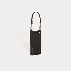 Crafted with soft, black pebble leather, the Emma wristlet takes a minimalist approach to keeping your phone, cards and cash in one hand. This classic add-on wristlet can be easily transformed into a stylish belt/purse accent or strap extender. Classic Bags With Wrist Strap For Everyday Use, Classic Everyday Bags With Wrist Strap, Classic Everyday Bag With Wrist Strap, Versatile Black Business Phone Bag, Modern Black Phone Bag For Everyday, Elegant Leather Rectangular Phone Accessories, Modern Wallets With Wrist Strap For Daily Use, Modern Leather Phone Accessories For Everyday Use, Versatile Everyday Phone Bag With Hidden Sleeve