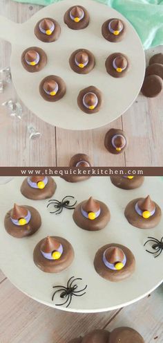 chocolate covered desserts are arranged on a white plate with spider decorations and yellow candies