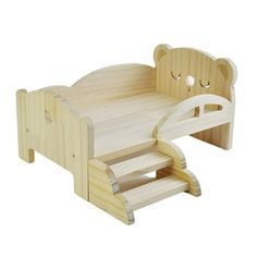 a wooden toy bed with a bear head on it's back end and footrests