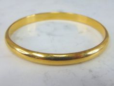 "A WOMENS 21k YELLOW GOLD BANGLE BRACELET THAT WEIGHS 11g AND MEASURES 7 3/4\" FOR THE INNER CIRCUMFERENCE, BY 1/4\" WIDE. PIECE IS NOT STAMPED BUT HAS BEEN TESTED. ANY OTHER QUESTIONS PLEASE ASK. BE SURE TO CHECK OUT SOME OF MY OTHER GREAT ITEMS UP FOR SALE. THANK YOU. IF THERE ARE ANY ISSUES PLEASE CONTACT US, WE'RE ALWAYS HAPPY TO TRY TO HELP YOU OUT AS BEST AS WE CAN." Classic 22k Yellow Gold Bracelets, Classic 22k Yellow Gold Bracelet, Formal 22k Yellow Gold Cuff Bracelet, Classic 22k Gold Bracelet For Formal Occasions, Classic 22k Gold Bracelets For Formal Occasions, Formal 22k Gold Bracelet With 17 Jewels, 22k Gold Bracelets For Formal Occasions, Formal Yellow Gold Round Bangle, 22k Yellow Gold Bracelets For Anniversary