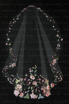 an embroidered veil with flowers and leaves on it, against a black background that is framed by thin strips of sheer fabric