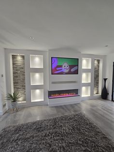 a living room with a fireplace and entertainment center