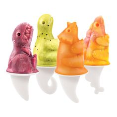 four different colored gummy bears sitting on top of each other in the shape of animals