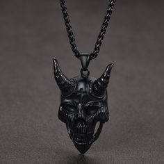 the skull was considered a repository of sacred power that immunizes a person from the forces of evil and gives him health and prosperity. Evil devil demon horn skull design, Gothic style, Cool necklace jewelry. This skull goat necklace is a perfect gift for men.  SPU:TP12483  Collection:Religious  Materials: Stainless Steel  Pendant Length: 5.3 cm  Pendant Width: 3.2 cm  Chain Length: 50+5 cm(20+2 inches)  Clean it with a soft dry cloth.  Keep away from water and chemicals.  Avoid wearing it wh Symbolic Black Halloween Necklace, Symbolic Black Necklace For Halloween, Black Skull Necklace For Halloween, Cool Necklace, Nordic Vikings, The Forces Of Evil, Pendant For Men, Viking Symbols, Norse Vikings