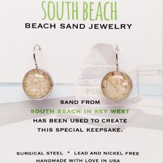 a pair of earrings is shown with the words, south beach jewelry sand from south beach in key west has been used to create this special keepsake