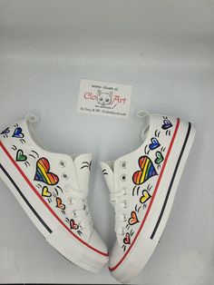 LGBT custom sneakers- the perfect gift for every LGBTQ pride . Make you day colorful and lovely with this hand painted custom sneakers.  This model is available as a t-shirt too ( women , man) . Please contact me if you want to order t-shirt.  DIFFERENT SIZES FOR WOMEN'S FOOTWEAR: EU size 36 ≈ US size 5 ≈ UK size 3≈ 22,5 cm ≈ 8,8 inches  EU size 37 ≈ US size 6 ≈ UK size 4 ≈ 23,5 cm ≈ 9,2 inches EU size 38 ≈ US size 7 ≈ UK size 5 ≈ 24 cm ≈ 9,5 inches EU size 39 ≈ US size 8 ≈ UK size 6 ≈ 25 cm ≈ 9,8 inches EU size 40 ≈ US size 9 ≈ UK size 7 ≈ 25,5 cm ≈ 10 inches EU size 41 ≈ US size 10 ≈ UK size 8≈ 26,5 cm ≈ 10,4 inches Pride Shoes Diy, Pride Converse, Lgbtq Clothing, Pride Shoes, Diy Sneakers, Preppy Shoes, Heart Shoes, Pride Gifts, Lgbtq Pride