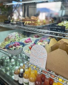 a display case filled with lots of different types of food and drinks on it's sides