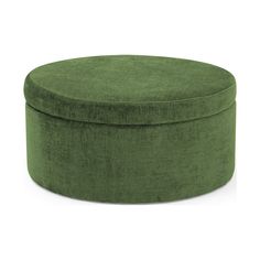 a green round ottoman sitting on top of a white floor