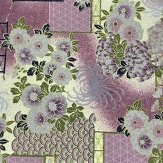 a purple and green floral pattern on fabric