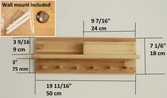 a wooden shelf with three pegs attached to it and measurements for the wall mount included