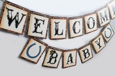 a welcome baby banner hanging from the side of a wall