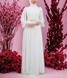 The dress is made of tulle fabric.  The inner side is lining. The belt can be removed from the dress. It is a dress suitable for long-term use. It is a wrinkle-resistant dress and does not show through. The dress has a breathable fabric and does not reveal the body lines. Long Sleeve Gown For Wedding, White Chiffon Dress For Banquet, Elegant Chiffon Dress With Sheer Sleeves For Wedding, Maxi Dress With Sheer Long Sleeves For Wedding, Wedding Maxi Dress With Sheer Long Sleeves, Long Sleeve Maxi Dress With Sheer Sleeves For Wedding, Elegant Eid Wedding Dress, Elegant Chiffon Wedding Dress With Sheer Sleeves, Long Sleeve Chiffon Dress For Wedding