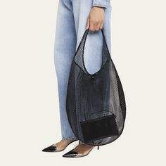 ALAIA shoulder bag in mesh nylon and leather  Flat shoulder strap Open top with self-tie closure  Unlined  Approx. 7.9"H x 15.8"W x 3.9"D Made in Italy Tote Outfit, Mesh Bag, Open Top, Leather Flats, Tops Designs, Shoulder Strap, In Italy, Mesh, Shoulder Bag