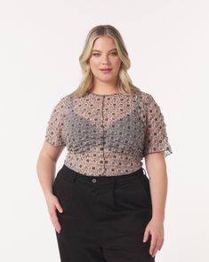 The "Serena" baby tee is a gorgeous sheer design - perfect for showing as much or as little skin as you like. This style is made from a high-quality, stretchy lace mesh developed in Turkey. The airy fabric has a light puff texture that drapes beautifully against the body and expands over your curves. Pair it with the "India" maxi skirt for a matching set and wear with your favorite bra or layer over our undergarment tube top for more coverage. Curves Design, Mesh Bag, Contrast Stitch, Baby Tee, Black Pattern, Tube Top, The Body, Infant Tees, Jacket Tops