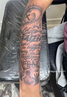 a person with a tattoo on their arm that says, you are the reason to fear