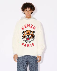 This graphic jumper offers a new take on the iconic House Tiger motif. A large version of the mascot,  embellished with the 'KENZO Paris' name, appears in intarsia on the front. We love the comfortable cut and dropped shoulders, which add to the streetwear style.
'KENZO Lucky Tiger' jumper.Genderless.Long sleeves.Round neck.Intarsia Tiger on the front. Graphic Jumper, Lucky Tiger, Jumper Designs, Kenzo Paris, Streetwear Style, Son Style, Knitwear Men, Style Streetwear, Streetwear Fashion