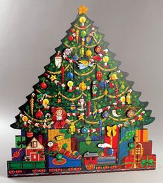 a christmas tree made out of different types of toys and decorations on it's sides