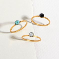 The Tiny Round Gemstone Stacking Ring are sold individually and shown here in turquoise, specularite (black), and mother of pearl.  Can be made with any crushed gemstone of your choice.  Gold plated over pewter with a slightly hammered look.  Sizes 6 and 7 available. Gold Turquoise Stackable Ring, Adjustable Gold Turquoise Gemstone Ring, Dainty Gold Turquoise Gemstone Ring, Adjustable Gold Turquoise Ring In Spiritual Style, Adjustable Gold Turquoise Ring, Gold Adjustable Turquoise Ring, Dainty Gold Turquoise Ring, Adjustable Gold Spiritual Turquoise Ring, Gold Stackable Turquoise Ring For Anniversary