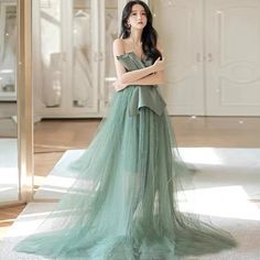 Strapless Green Gown For Debutante Ball, Green Strapless Ball Gown For Wedding, Strapless Green Ball Gown For Prom Season, Strapless Green Ball Gown For Prom, Green Strapless Ball Gown For Prom, Green Strapless Tulle Dress, Green Ball Gown With Sweetheart Neckline For Prom, Green Strapless Dress For Prom, Floor-length Green Bridesmaid Dress For Banquet