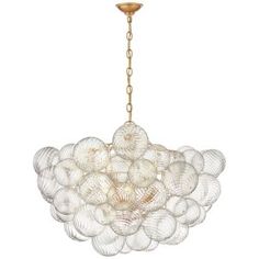 a large chandelier with many glass balls hanging from it's golden chain