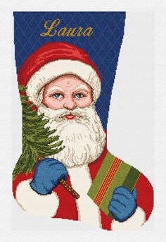 a cross stitch santa holding a christmas tree