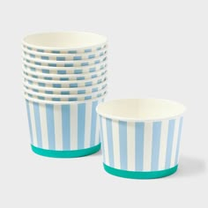 blue and white striped cups stacked on top of each other