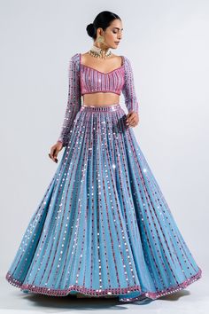 Ice blue lehenga with mirror embroidery in a stripe pattern and multicolor thread work. Comes with full sleeve blouse and border embroidered dupatta.
Components: 3
Pattern: Embroidery
Type Of Work: Mirror
Neckline: Sweetheart
Sleeve Type: Long
Fabric: Lehenga and Blouse- Georgette and Dupatta: Satin Organza
Color: Blue
Other Details: 
Low back with tie up and tassels
Dupatta with mirror embroidered border
Closure: Back hook
Note: Choker worn by the model is not for sale
Occasion: Sangeet - Aza F Long Sleeve Lehenga, Mirror Work Lengha, Ice Blue Lehenga, Bestie Wedding, Plain Lehenga, Embellished Lehenga, Lengha Blouse, Lengha Blouse Designs, Vani Vats