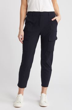 Soft and ultrastretchy fabric means all-day comfort in these relaxed-fit cargo pants boasting a breezy cropped fit and a plethora of handy pockets. 26" inseam; 13" leg opening;10 3/4" front rise; 15" back rise (size Medium) Zip fly with hook-and-bar closure Front slant pockets; cargo flap-patch pockets 68% nylon, 32% elastane Machine wash, line dry Imported Functional Cargo Pants With Multiple Pockets For Work, Functional Cargo Pants With Cargo Pockets For Work, Sporty Cargo Pants With Multiple Pockets For Work, Functional 4-way Stretch Bottoms With Cargo Pockets, Sporty Cargo Pants With Side Pockets For Work, Sporty Tapered Leg Cargo Pants For Work, Sporty Relaxed Fit Cargo Pants For Work, Athleisure Workwear Bottoms With Pockets, Athleisure Bottoms With Pockets For Work