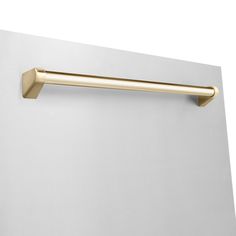 a gold handle on the side of a white wall