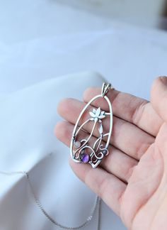 The size H 4 cm x W 3 cm (1 3/4 x 1 inch). Weight - 6g. You can buy it with the chain or without. The most delicate flower of the lotus can make someone very happy. I made this botanical jewelry of sterling silver, amethyst, and peach moonstone. This is a true work of art. It will emphasize your exquisite taste and status, and will also bring a lot of compliments. Lotus flower earrings https://www.etsy.com/listing/676137548/lotus-flower-earrings-sterling-silver?ref=shop_home_active_2&frs=1 O Flower Necklace Silver, Lotus Flower Necklace, Silver Flower Necklace, Dragonfly Pendant, Botanical Jewelry, Jewelry Wire, Peach Moonstone, Dragon Pendant, Amethyst Pendant