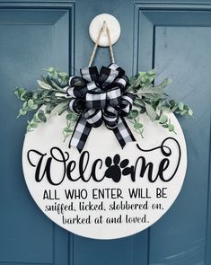 a welcome sign hanging on the front door