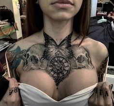 a woman with a butterfly tattoo on her chest