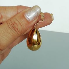 A PAIR of chunky gold plated teardrop and dangle earrings. Size: Ball: 29 x 17 mm Drop length: 42mm. Weight: 10gm Price listed is for ONE PAIR These are made of 925 hypoallergenic sterling silver, plated in gold. Most of my pieces come with a 925 stamp. Can be packaged in a gift box. I can include a personal message from you if needed You are welcome to contact me at... bhavnakwintra1956@gmail.com For more beautiful pieces from my shop, please browse 👇 TOE RINGS: https://www.etsy.com/your/shops Gold Pear-shaped Teardrop Single Earring, Gold Dangle Drop Earrings For Party, Gold Teardrop Pendant Earrings For Gift, Gold Teardrop Pendant Earrings For Party, Shiny Finish Teardrop Earrings As A Gift, Shiny Finish Dangle Earrings Gift, Shiny Finish Dangle Earrings For Gift, Teardrop Earrings With Shiny Finish As A Gift, Shiny Dangle Earrings For Gift