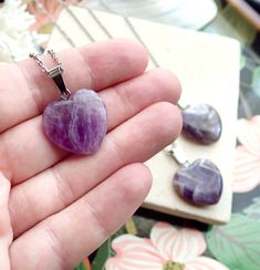 This polished genuine amethyst heart pendant hangs from your choice of chain.The February birthstone, amethyst, is said to strengthen relationships and give its wearer courage. At one time, only royalty could wear the gem. Ancient Greeks thought that the amethyst guarded against intoxication. In fact, “amethyst” comes from amethystos, a Greek word meaning “sober.”Amethysts are the birthstone for February and also traditionally given on the 6th wedding anniversary.- 18" Rhodium Plated Chain. ‚Ä¢ Amethyst Birthstone Heart Pendant Jewelry, Amethyst Gemstone Jewelry For Valentine's Day, Heart-shaped Amethyst For Jewelry Making, Heart Shaped Amethyst For Jewelry Making, Heart Cut Amethyst Jewelry For Gifts, Valentine's Day Amethyst Gemstone Jewelry, Purple Amethyst Jewelry With Heart Charm, Purple Amethyst Heart Necklaces, Purple Amethyst Heart Necklace