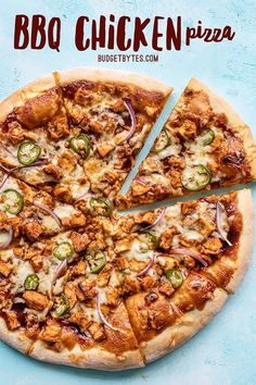 the bbq chicken pizza is cut into four pieces and sits on a blue surface