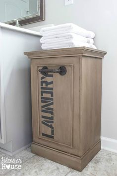 a cabinet with towels stacked on top of it