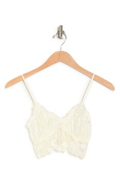 Delicate lace plays up the romantic charm on this soft cup bralette styled with dainty spaghetti straps. 90% nylon, 10% spandex
 Machine wash cold, lay flat to dry
 Imported White Lace Bra With Adjustable Straps, Delicate Lace Bra With Lace Trim, Lace Camisole Bra Friendly, Cream Lace Bra With Lace Trim, Spring Lace Cami Bra, Spring Lace Beige Bra, Spring Beige Lace Bra, Summer Bra With Delicate Lace And Spaghetti Straps, Lace Bra With Spaghetti Straps