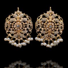 Meticulously designed to perfection! Classic pair of earrings adorned with beautiful CZ stones and pearl detailing. Approximate earrings length is 2". Gold-plated on high-quality brass as base metal. Made by order. Kindly allow 5-7 weeks for the delivery of this item. For custom or urgent requests, please contact support@alacouture.com. *Please Note: We use faux stones and beads in all of our jewelry. Elegant Gold-plated Chandelier Earrings With Intricate Design, Ornate Gold Kundan Earrings, Ornate Gold Brass Chandelier Earrings, Ornate Yellow Gold Brass Earrings, Gold-tone Gold Plated Chandelier Earrings, Unique Gift Cards, Faux Stone, Gold And Silver, Base Metal