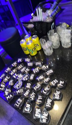 a table topped with lots of different types of cups and glasses next to each other