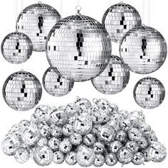 a bunch of shiny silver disco balls hanging from strings and some are filled with them